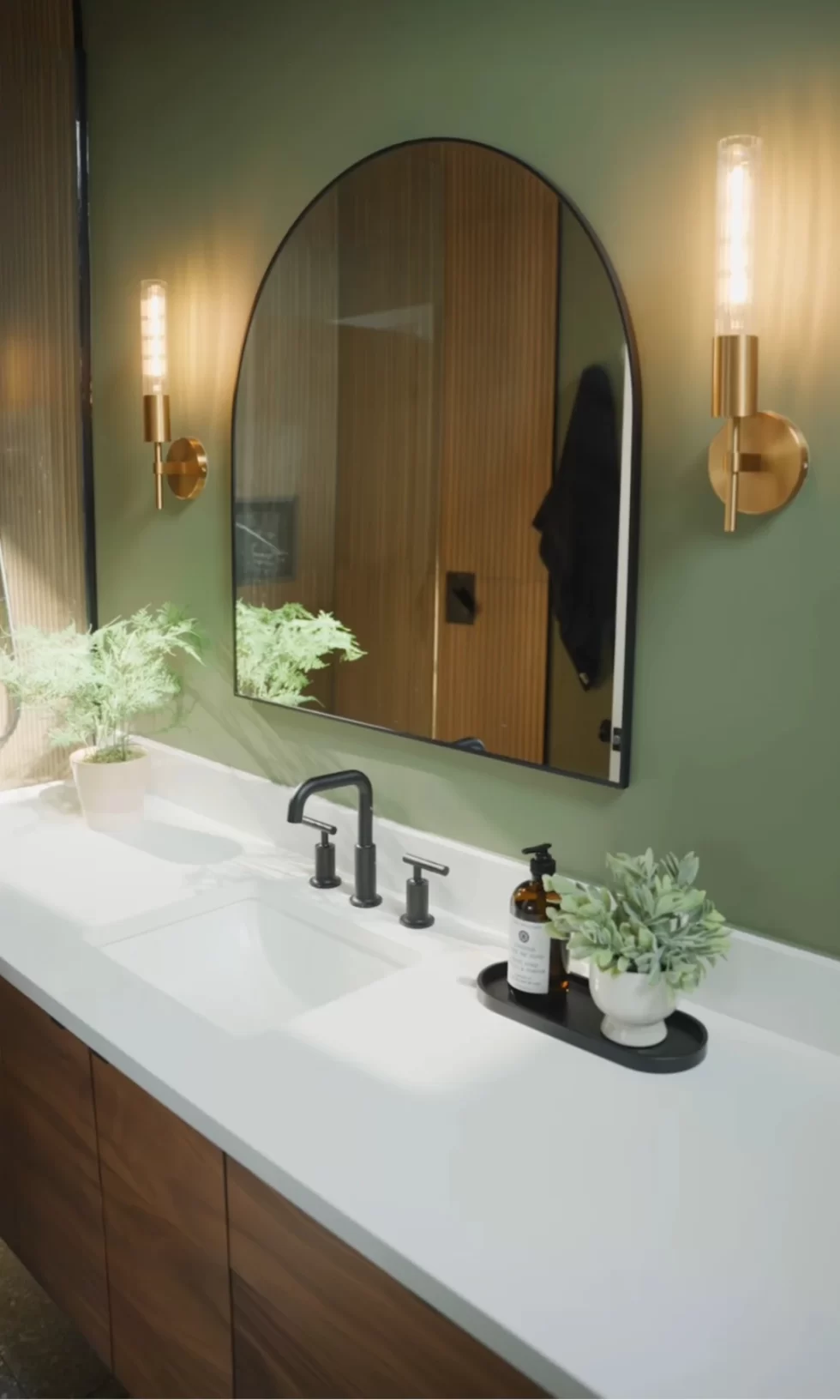 Modern green and white bathroom vanity project by BWB Construction in Hamilton, Ontario